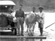 Frank’s five-passenger Ford crossing a river